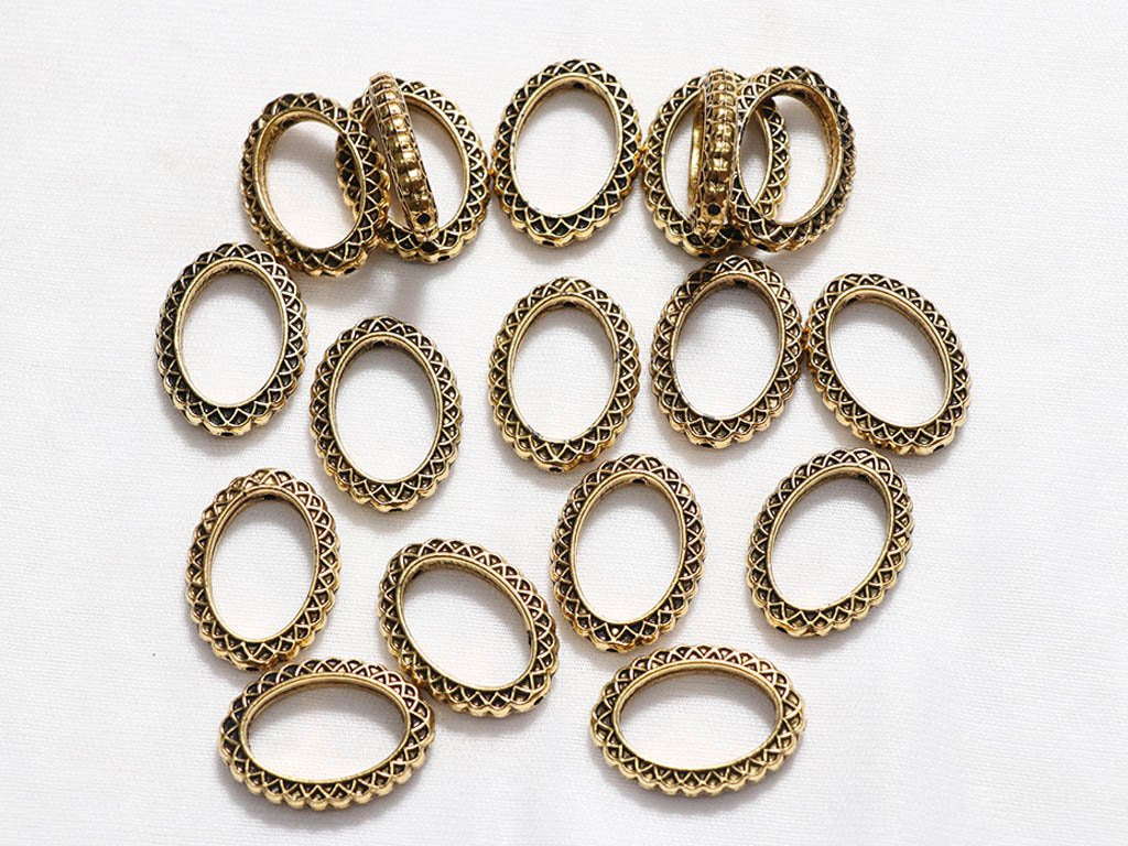 golden-oval-designer-ring-plastic-beads-18x25-mm