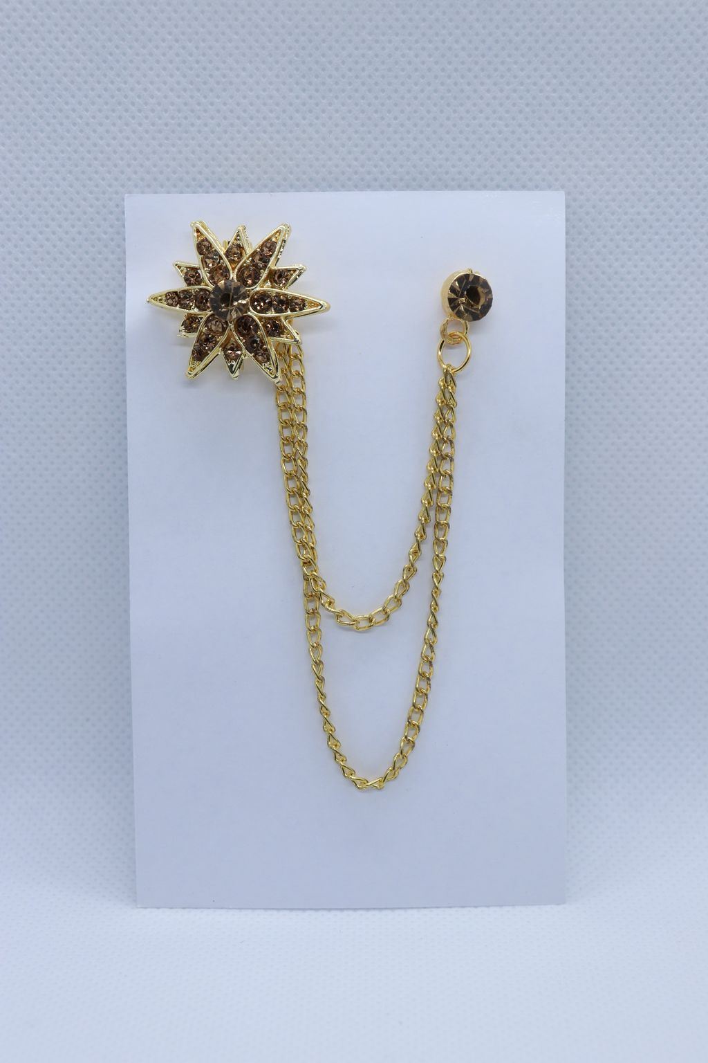golden-star-stone-studded-metallic-brooch