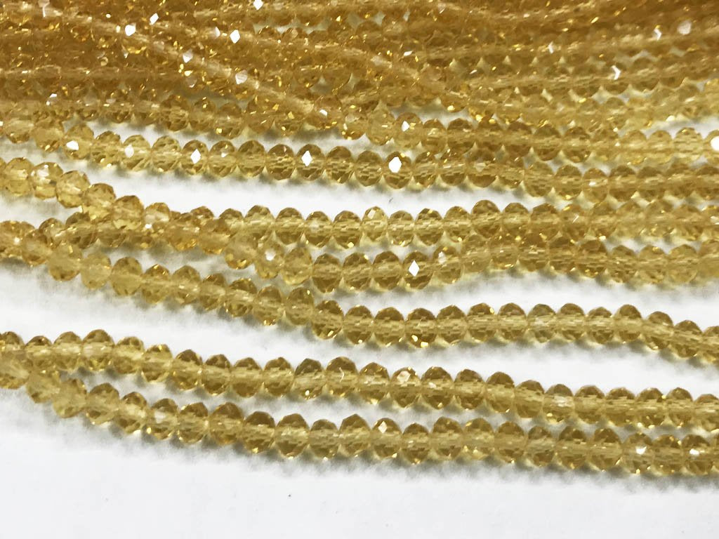 golden-transparent-tyre-glass-crystal-beads-4-mm