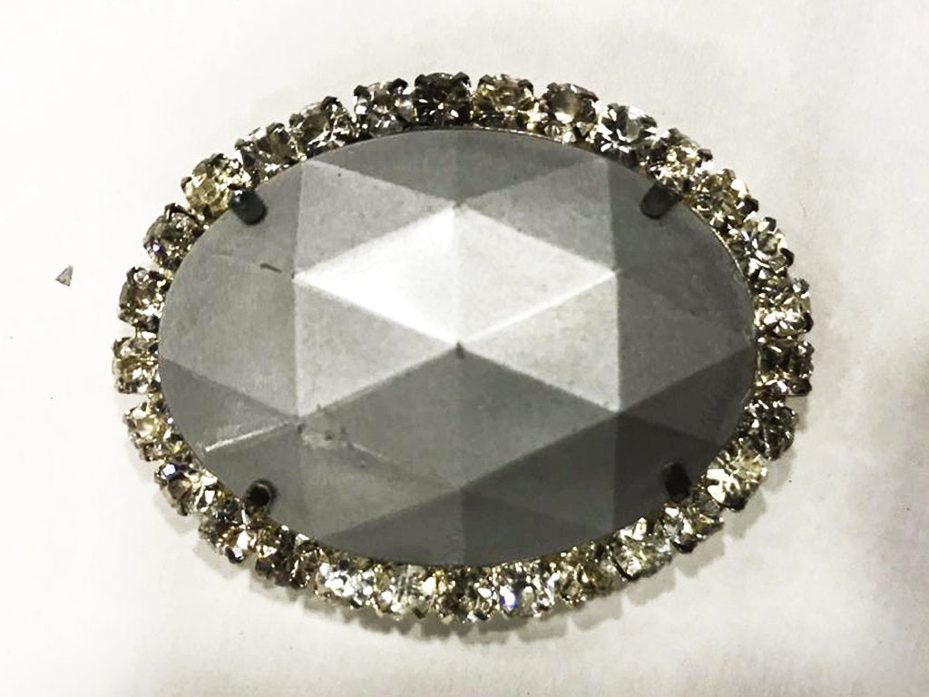 gray-oval-plastic-stone-with-crystal-frame-25x18-mm