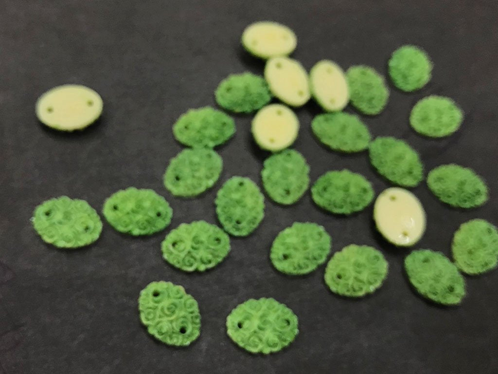 green-matte-flower-oval-resin-stone-2-hole-14x10-mm