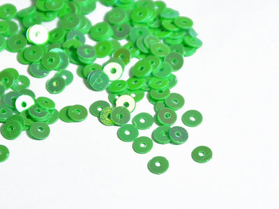 green-opaque-circular-plastic-sequins