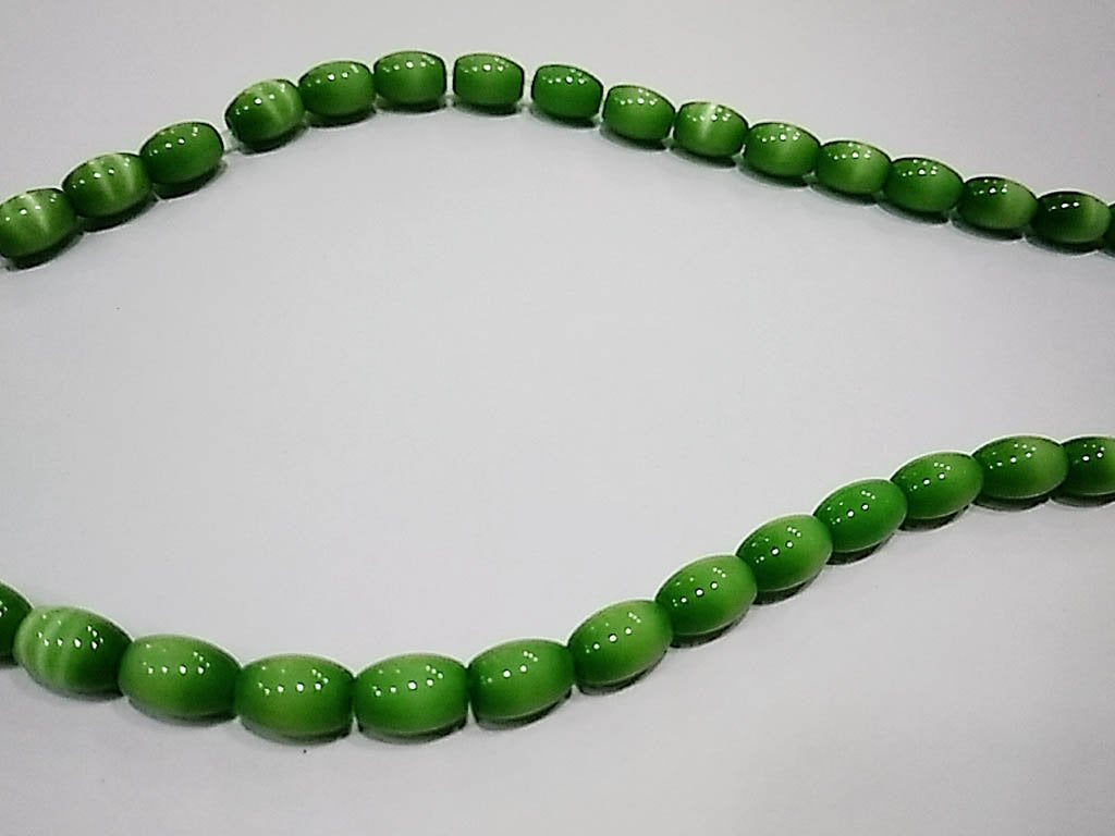 green-opaque-oval-pressed-glass-beads-5x8-mm