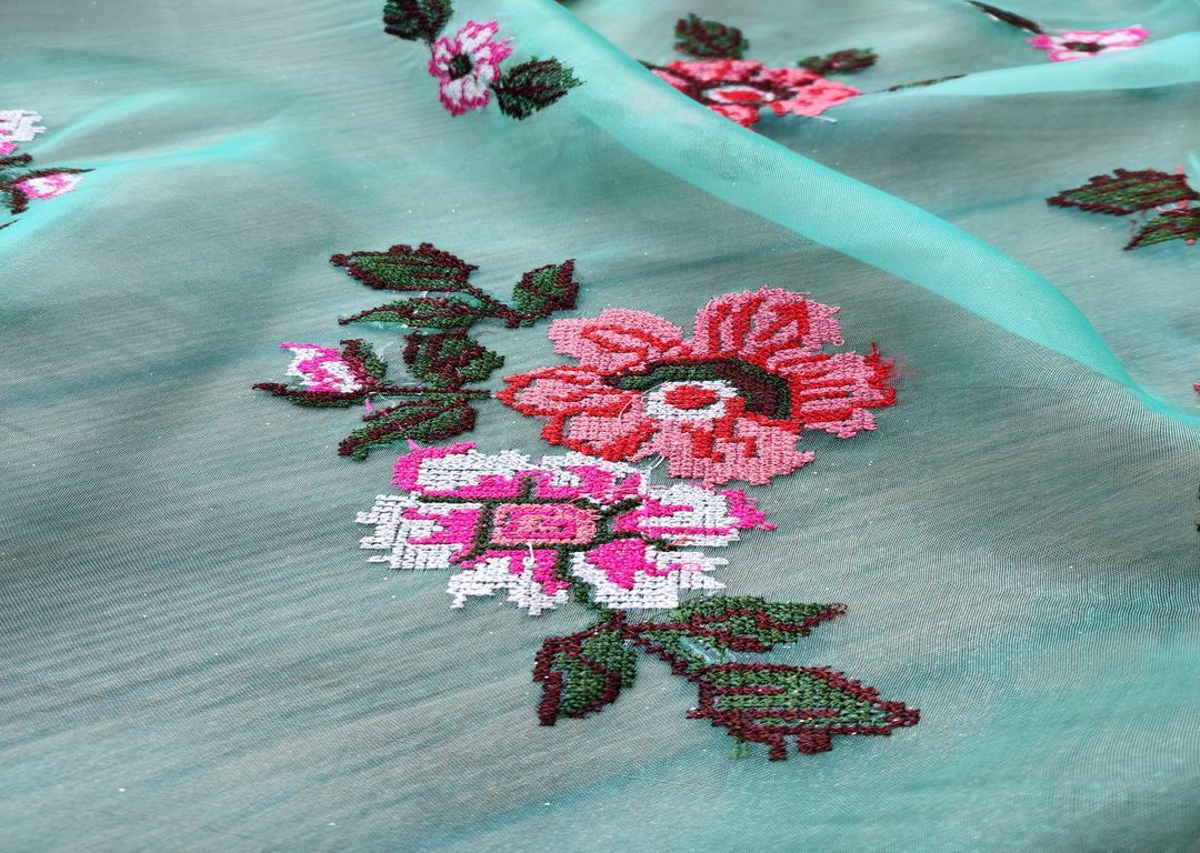 green-organza-with-multicolored-cross-stitch-flowers-all-over