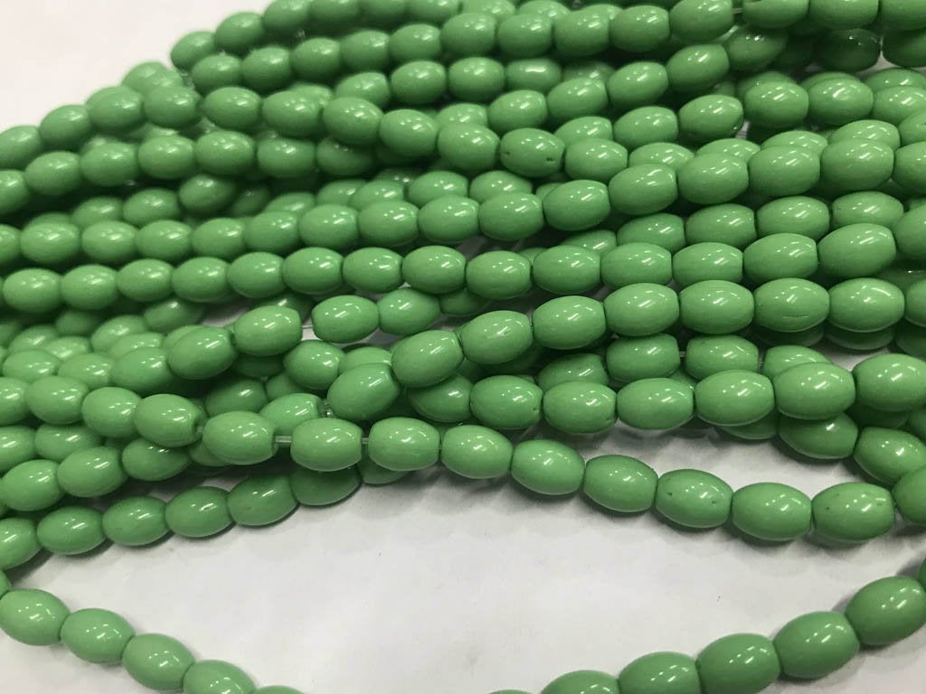 green-oval-pressed-glass-beads-5x8-mm