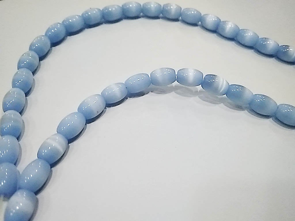 light-blue-opaque-oval-pressed-glass-beads-5x8-mm