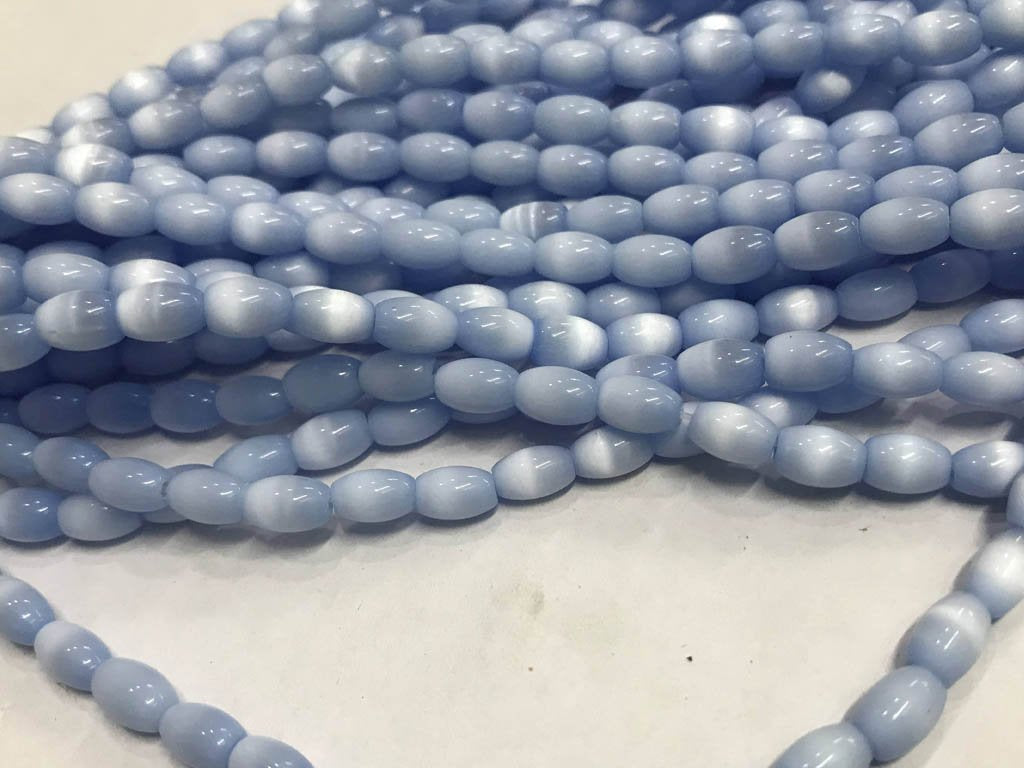 light-blue-oval-pressed-glass-beads-5x8-mm