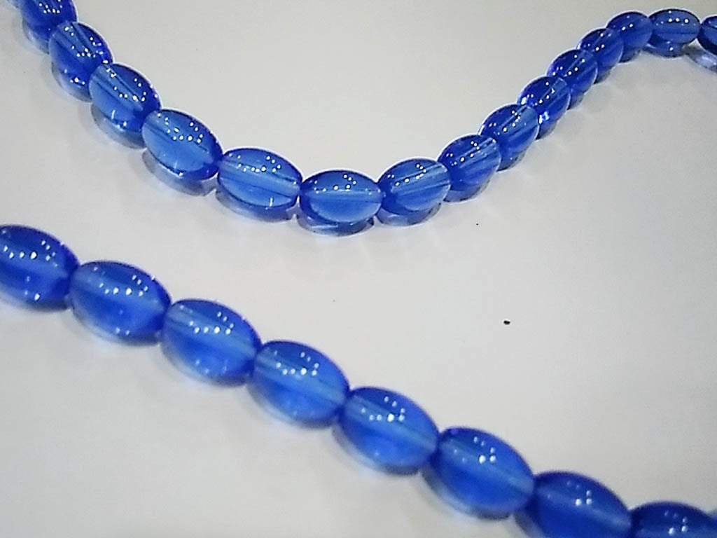 light-blue-transparent-oval-pressed-glass-beads-7x10-mm