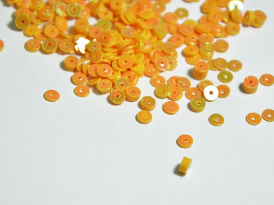 light-orange-opaque-circular-plastic-sequins