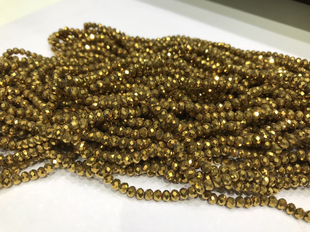 metallic-golden-tyre-glass-beads