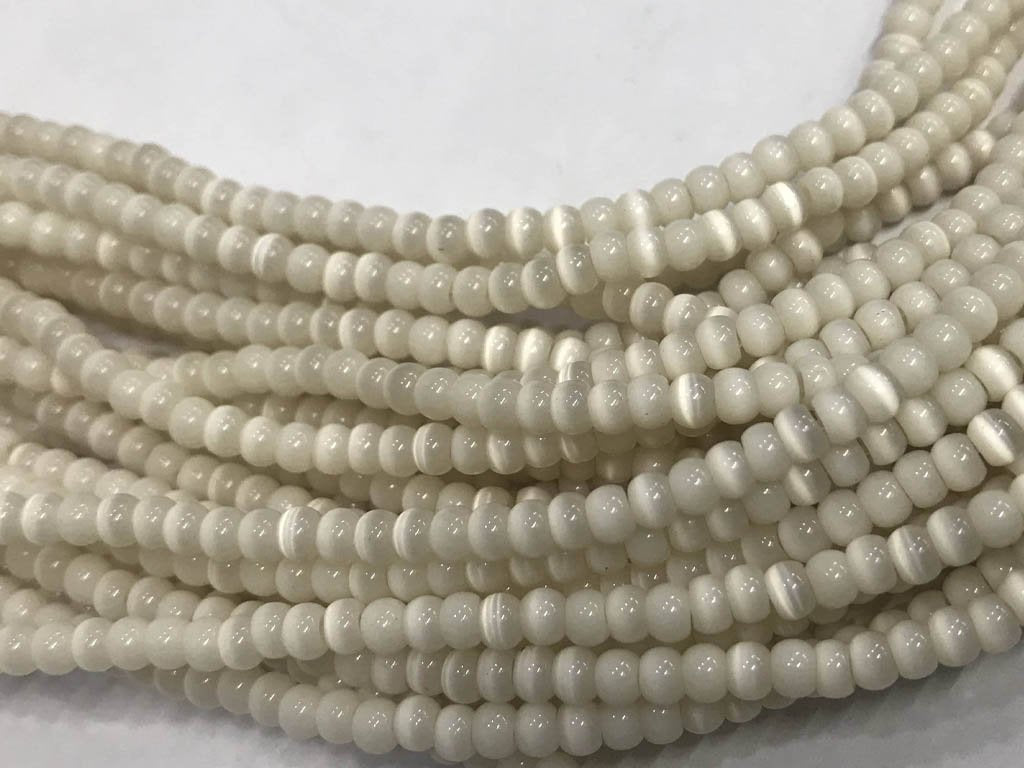 off-white-circular-pressed-glass-beads-3-mm
