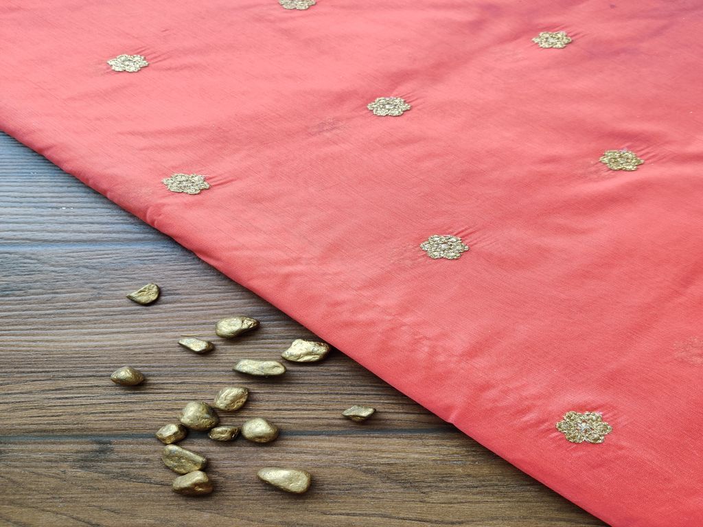 orange-chanderi-fabric-with-embroidered-golden-flowers-all-over