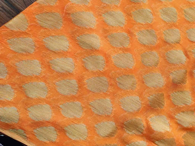 orange-fine-georgette-fabric-with-golden-buttas-all-over