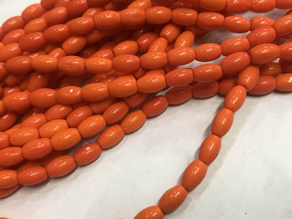 orange-oval-pressed-glass-beads-5x8-mm