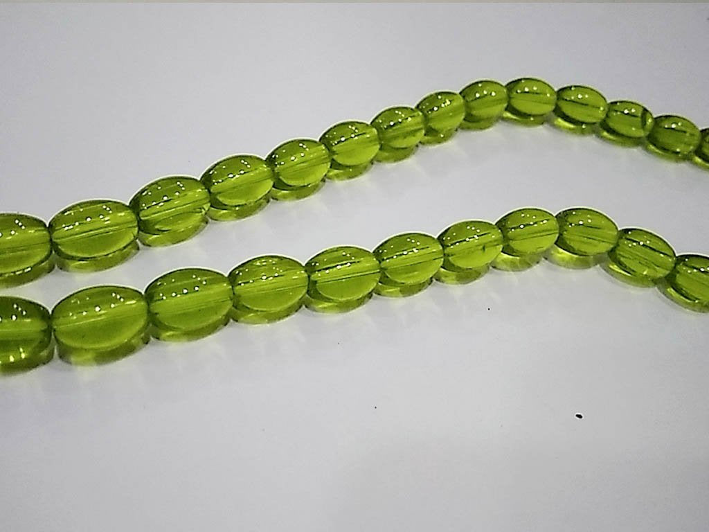 peridot-green-transparent-oval-pressed-glass-beads-7x10-mm