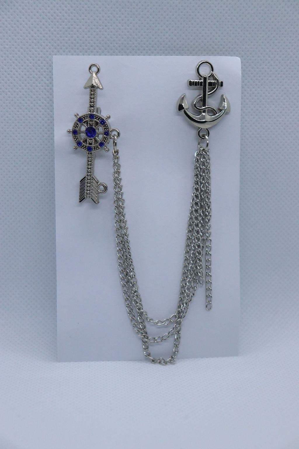 silver-arrow-with-blue-stone-wheel-metallic-brooch