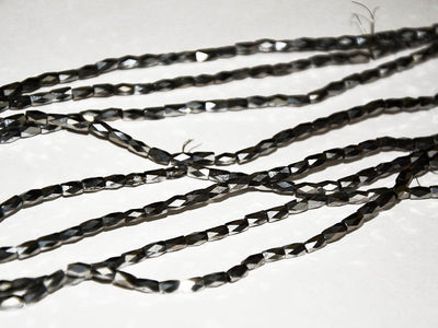 silver-faceted-tube-crystal-beads