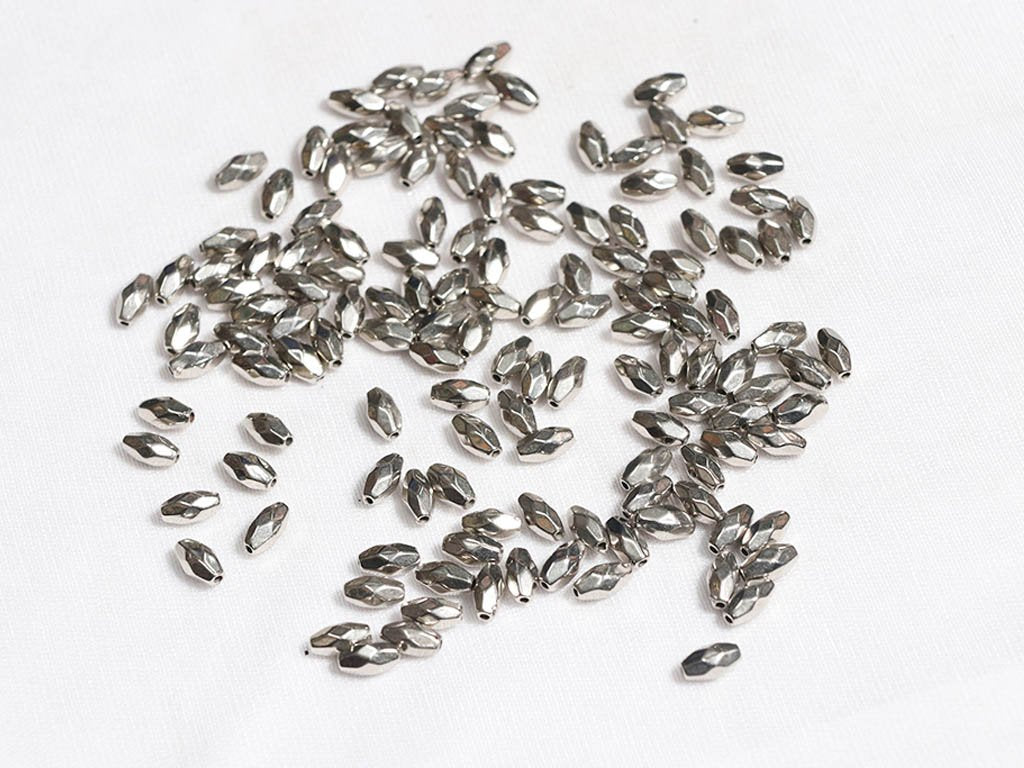 silver-seed-designer-plastic-beads-8x4-mm