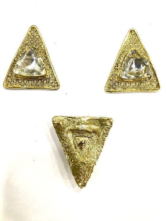 triangular-metal-piece-with-white-stone
