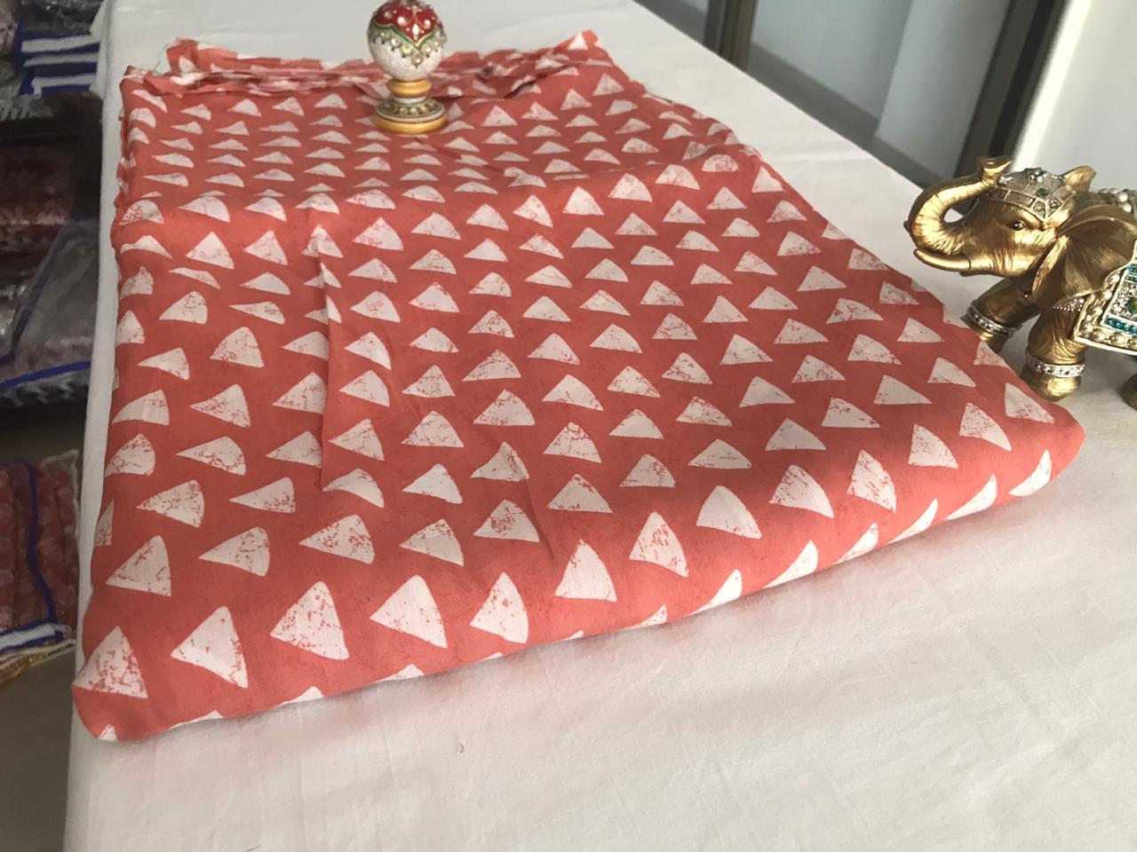 viscose-muslin-silk-hand-screen-triangle-print-fabric-rust-orange