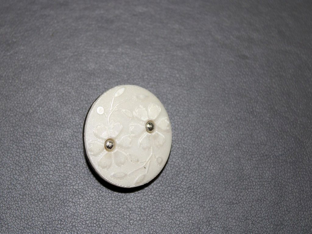 white-floral-embossed-buttons