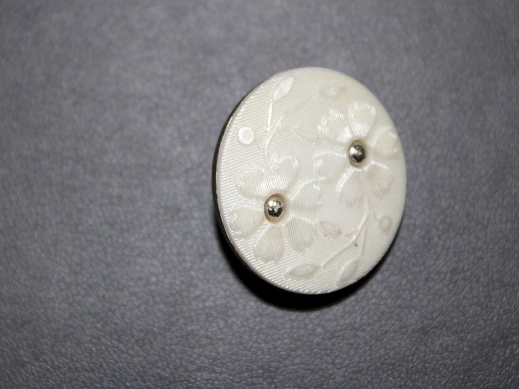 white-floral-embossed-buttons