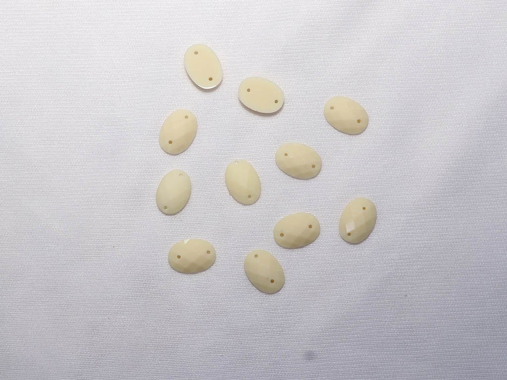 white-2-hole-oval-dyeable-plastic-stones-10x14-mm