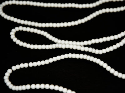 white-circular-opaque-pressed-glass-beads