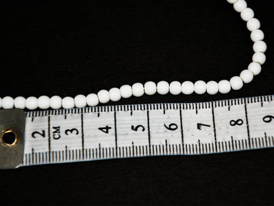 white-circular-opaque-pressed-glass-beads
