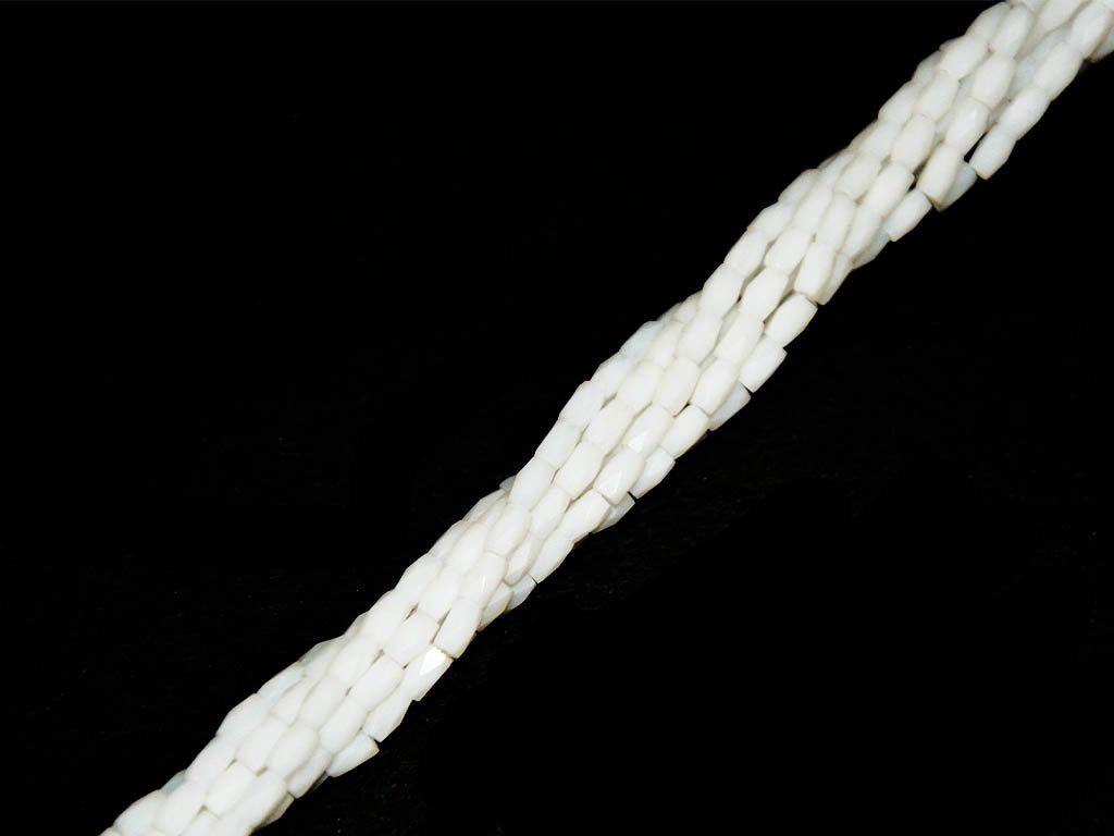 white-opaque-faceted-tube-crystal-beads