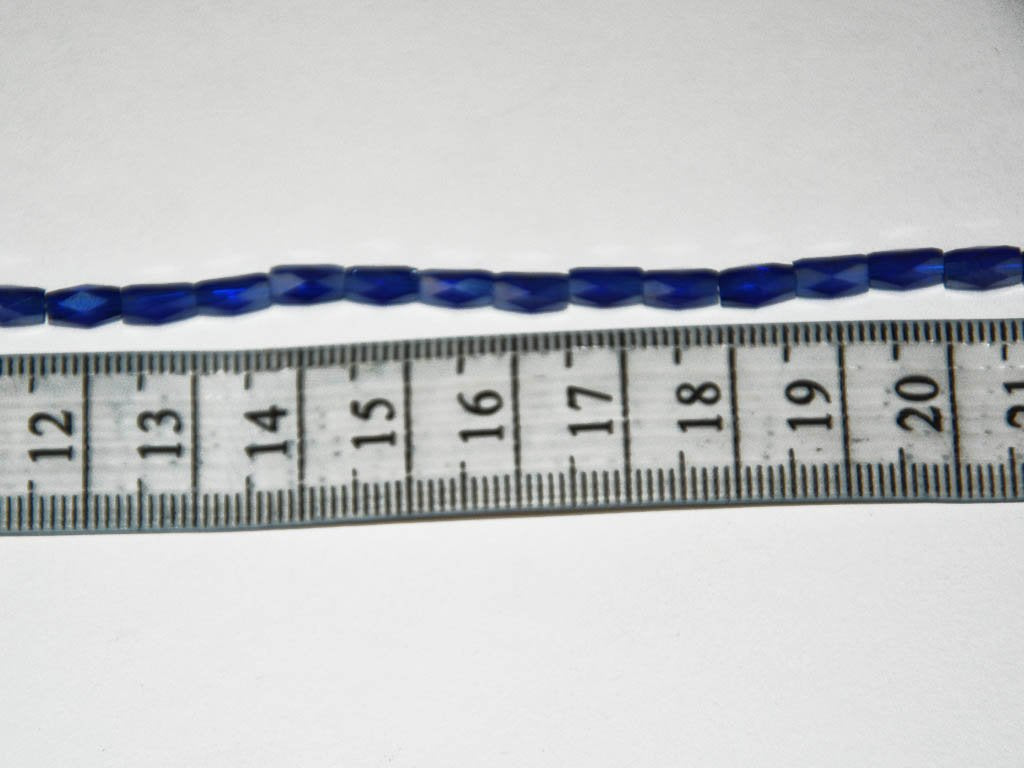 white-opaque-faceted-tube-crystal-beads