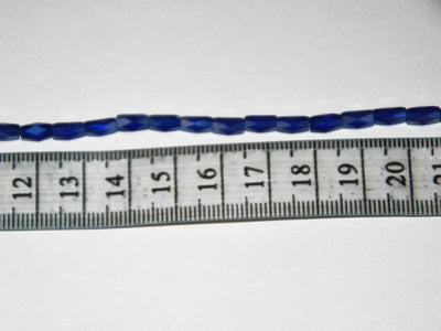 white-opaque-faceted-tube-crystal-beads