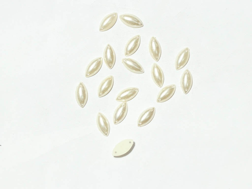 white-pearl-2-hole-eye-plastic-stones-15x7-mm