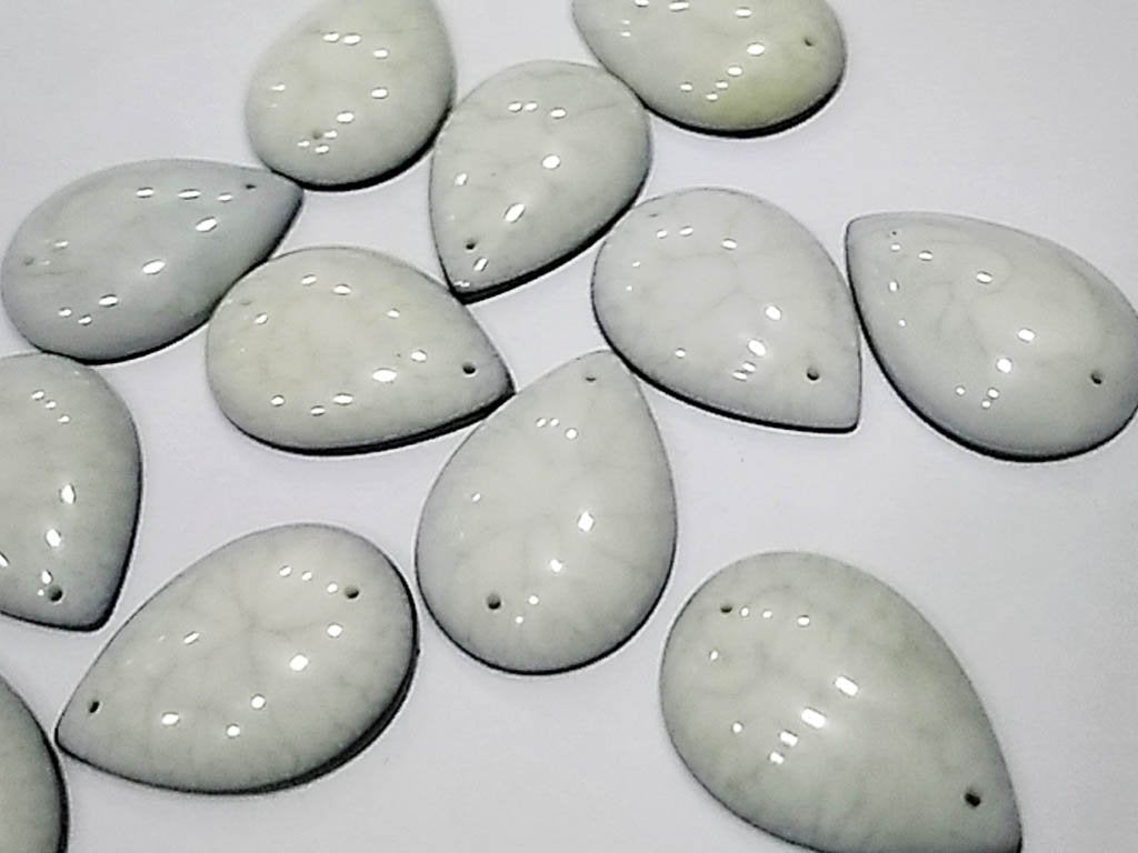 white-textured-drop-2-hole-plastic-stones-25x18-mm