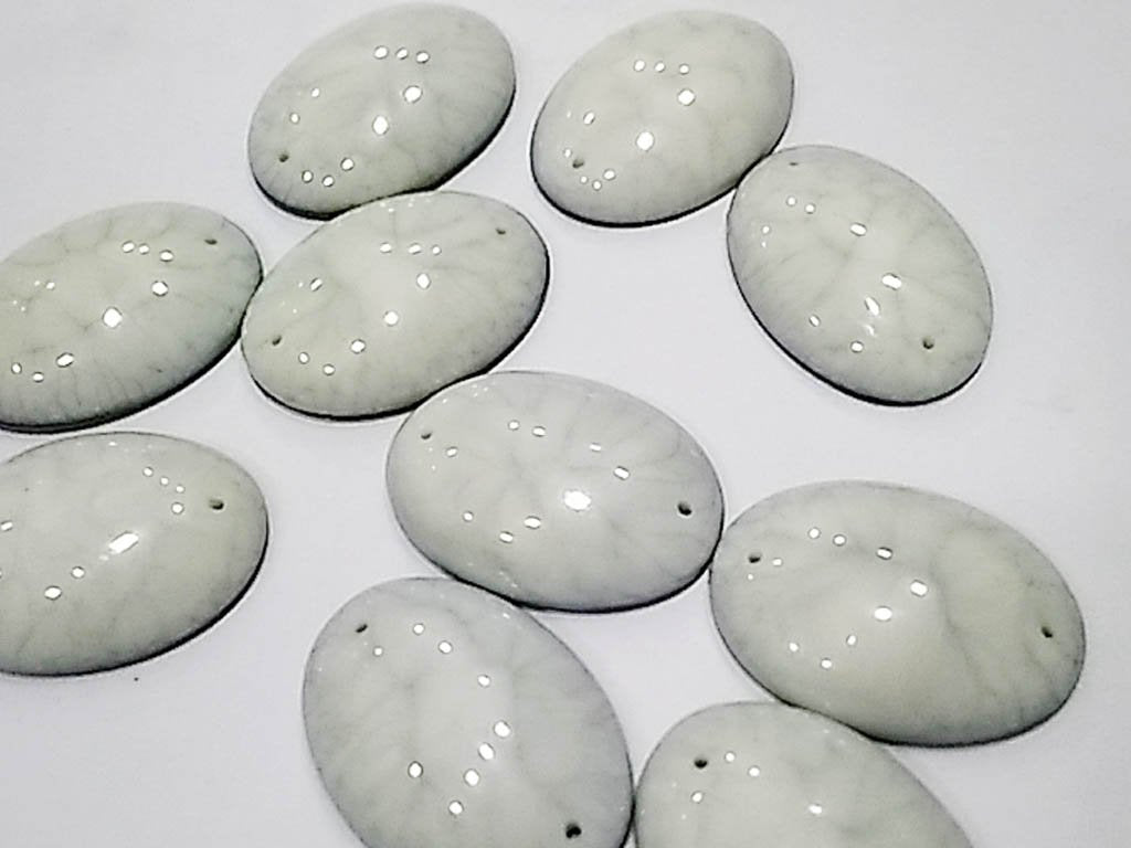 white-textured-oval-2-hole-plastic-stones-25x18-mm