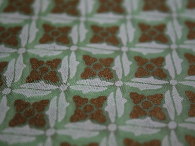 white-and-gold-floral-design-on-green-base-chaderi-fabric