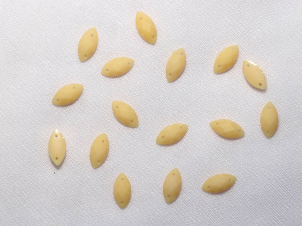yellow-2-hole-eye-dyeable-plastic-stones-8x4-mm