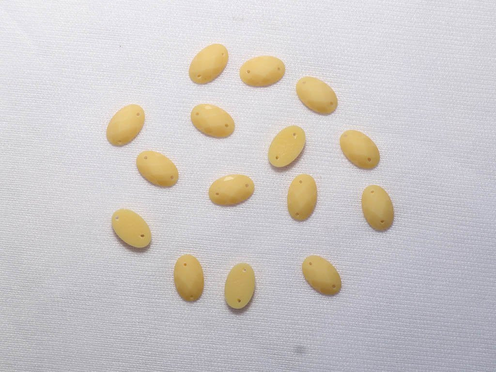 yellow-2-hole-oval-dyeable-plastic-stones-8x10-mm
