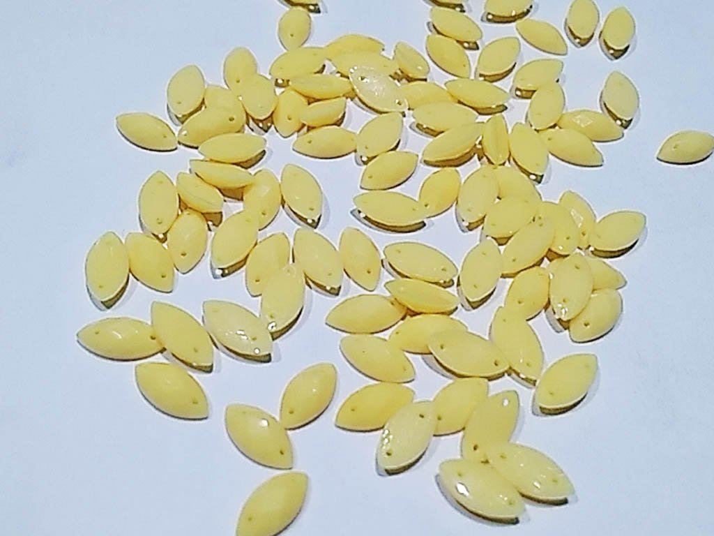 yellow-dyeable-eye-2-hole-plastic-stones-10x5-mm