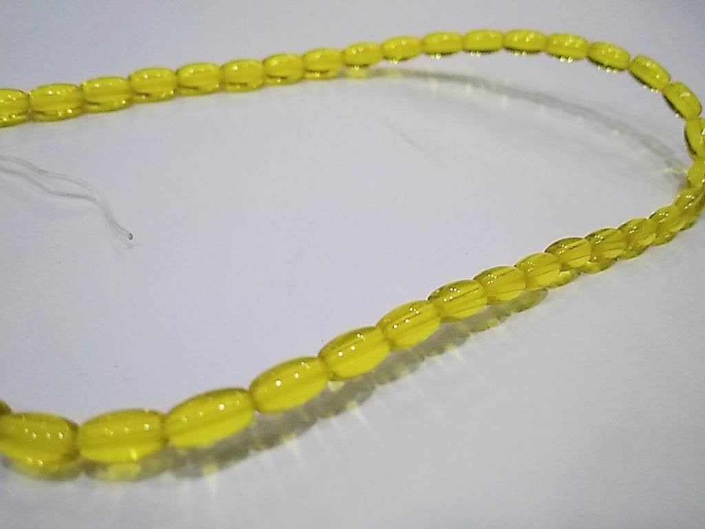 yellow-transparent-oval-pressed-glass-beads-4x7-mm