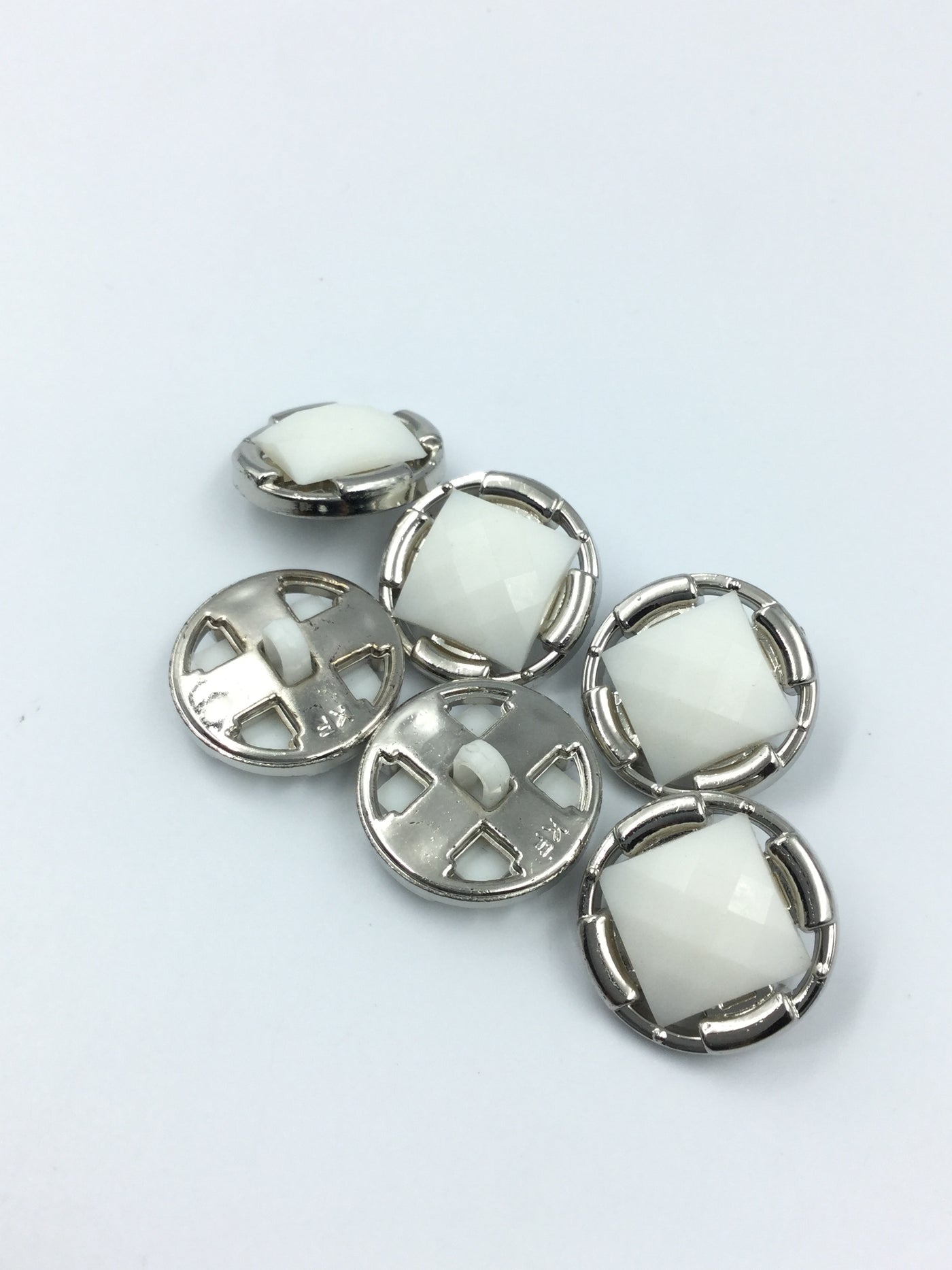 White & Silver Plastic Buttons