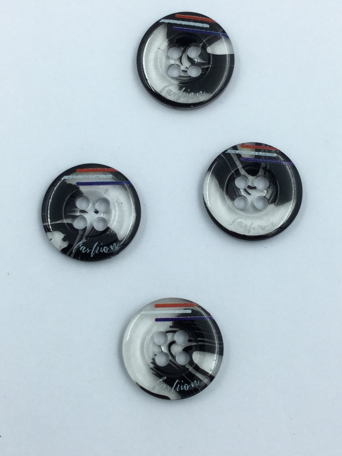 White and Black Circular Plastic Shirt Buttons